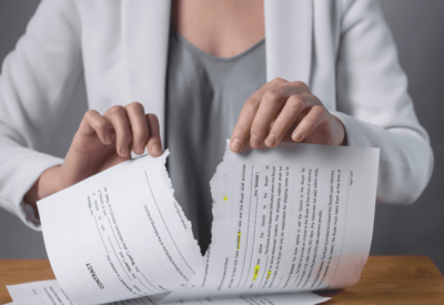 Woman tearing up her leasing contract