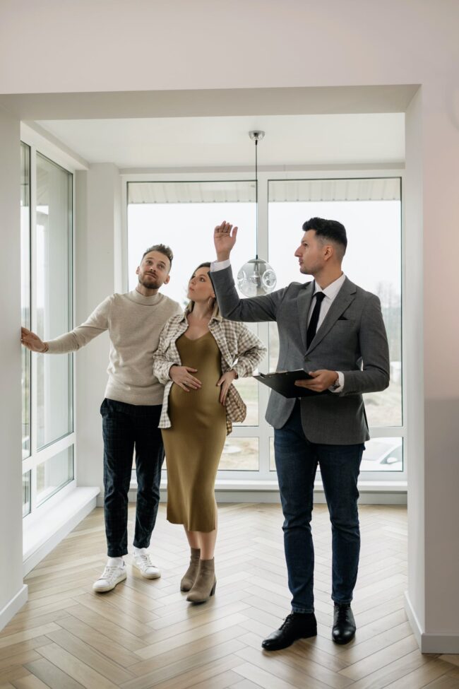 a knowledgeable property manager shows prospective renters a house