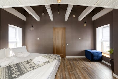 A tenant's spacious modern bedroom with the door shut.