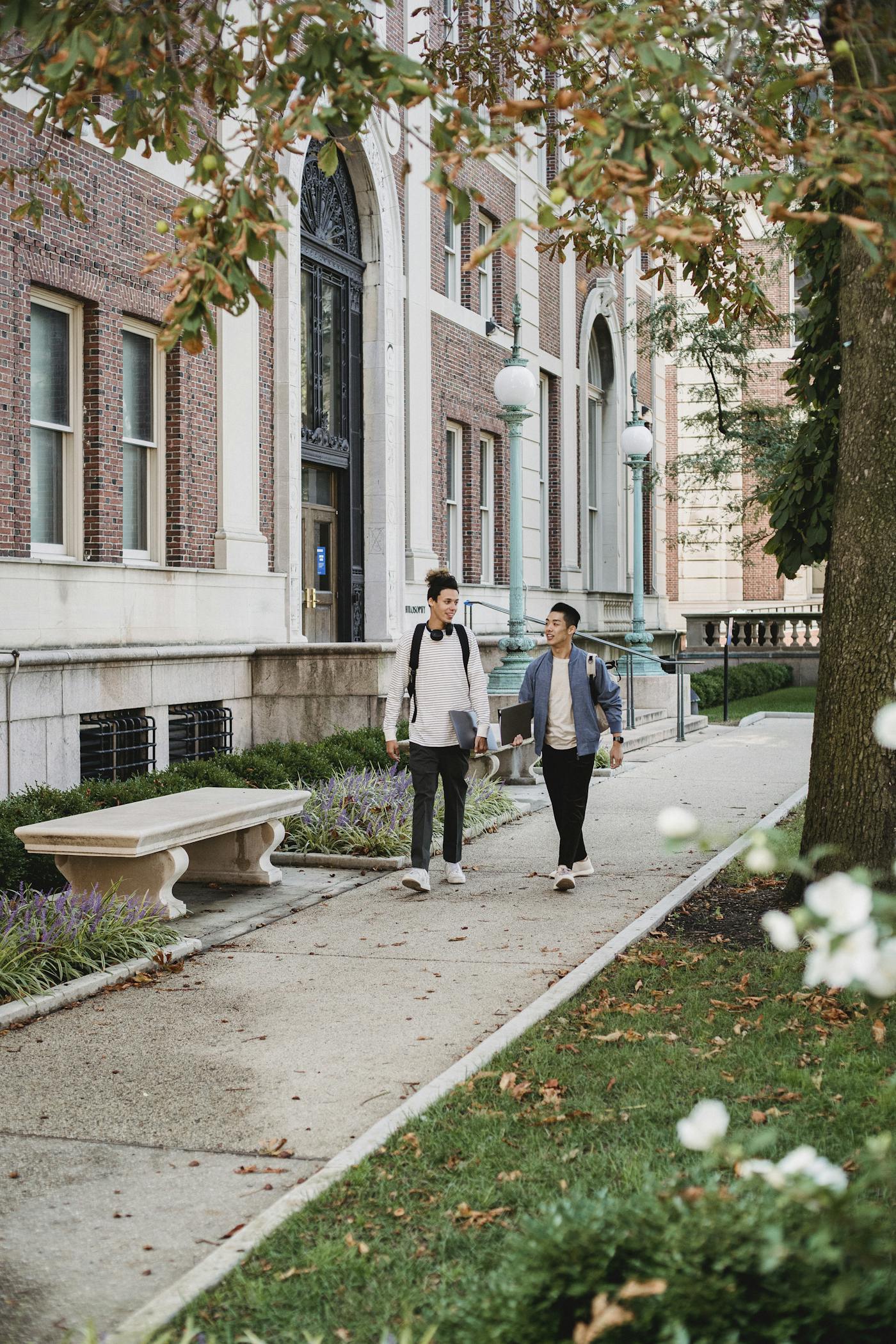 Residents walking on college campus who rent from a property management company