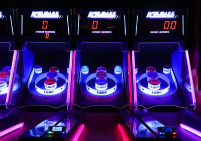 Vibrant and illuminated ski ball machines in a dark arcade setting showcasing the new Dave and Buster's coming to Wilmington, NC.