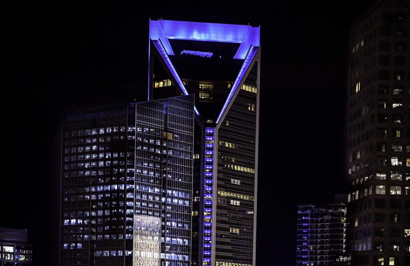 Stunning night view of Duke Energy Center in Charlotte, NC, showcasing the population boom arriving daily.