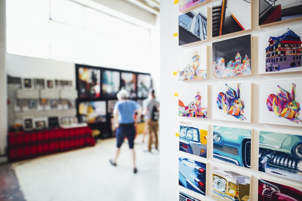 Colorful artwork showcased in a modern gallery setting with people browsing showcasing art for art enthusiasts in the South Carolina area.