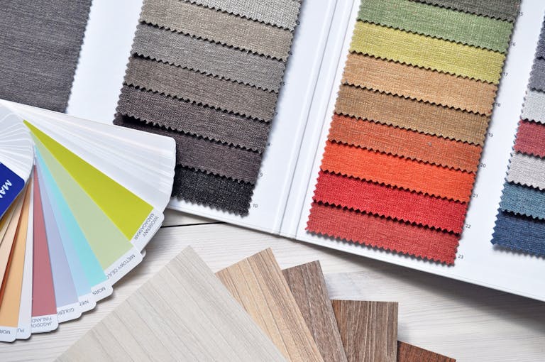Colorful fabric and paint swatches laid out for design inspiration and material selection showcasing the Home Show in Raleigh, North Carolina.