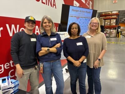 MoveZen Charlotte team volunteering at Second Harvest Food Bank of Metrolina during Hunger Action Month