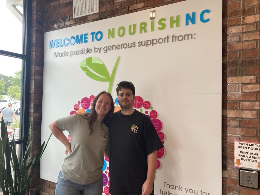 MoveZen Property Management team members volunteering at NourishNC in Wilmington, NC